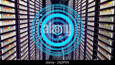Image of neon blue round scanner spinning against computer server room. Computer interface and business data storage technology concept Stock Photo