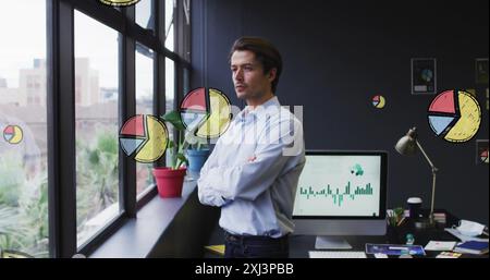Image of multiple pie graph icons over thoughtful caucasian man looking out of window at office. Computer interface and business data technology conce Stock Photo