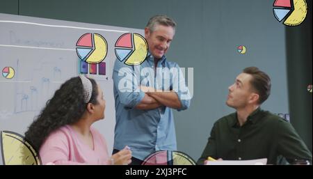 Image of multiple pie graph icons over diverse colleagues discussing together at office. Computer interface and business data technology concept Stock Photo