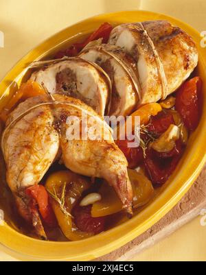 Roasted rabbit necks and peppers marinated in honey Stock Photo