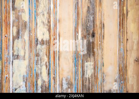 Old door restoration - close up detail of sanded wooden door filled with wood filler showing layers of old paint - UK Stock Photo