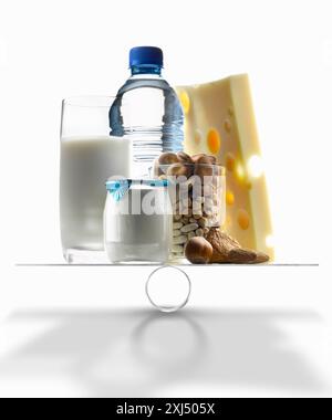 Selection of products with a high level of calcium on scales Stock Photo