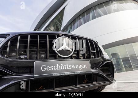 Mercedes company car, radiator grille and Mercedes star on a modern vehicle, in the background the Mercedes-Benz Museum, Baden-Wuerttemberg, Germany Stock Photo