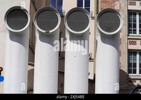 Detail, Centre Georges Pompidou, Paris, France, Europe, Four large white pipes protruding from a building facade and creating an industrial Stock Photo