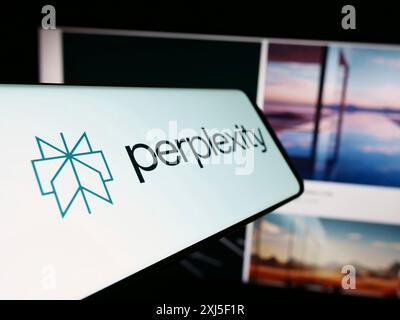 Stuttgart, Germany, 02-16-2024: Cellphone with logo of American artificial intelligence company Perplexity AI in front of business website. Focus on Stock Photo