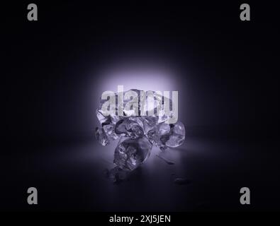 Ice cubes in a cold white light on a black background.  Fine details. Abstract effect. Stock Photo