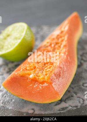 A piece of papaya Stock Photo - Alamy