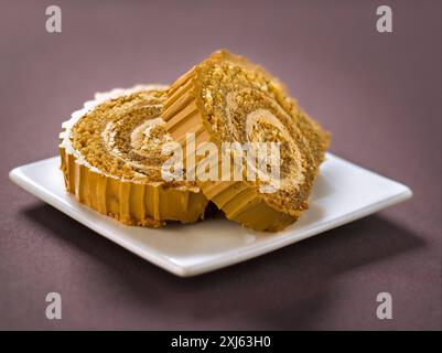 Slices of Christmas coffee log cake Stock Photo