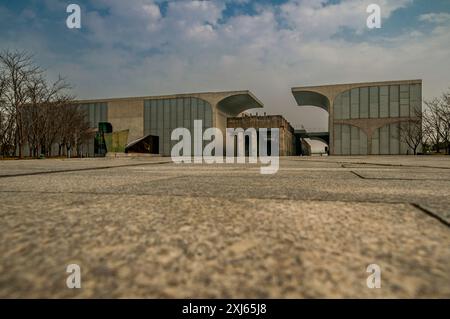 Old railway tracks leading to a preserved 1950s bridge for loading coal trucks surround by the industrial chic architecture of the Long Museum West Bu Stock Photo