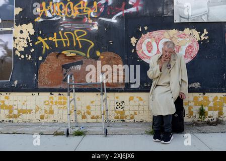 Milwaukee, United States. 16th July, 2024. An elderly homeless woman who was a friend of the homeless man that was killed smokes a cigarette near the crime scene where a homeless man was killed by Ohio State Policemen outside the RNC in Milwaukee, Wisconsin on Tuesday, July 16, 2024. The city of Milwaukee is hosting the 2024 Republican Convention which will run from July 15th through July 18th. Photo by Paul Beaty/UPI Credit: UPI/Alamy Live News Stock Photo