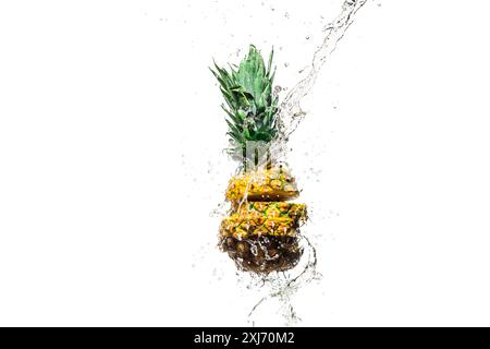 fresh sliced pineapple in water splashes isolated on white Stock Photo