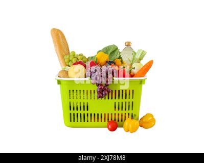 Fresh fruits and vegetables grocery product in green shopping basket isolated on white background with clipping path Stock Photo