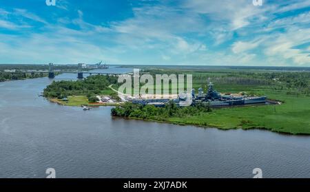 Aerial close up view of the North Carolina battleship from WWII permanently docked across from Wilmington NC historic downtown Stock Photo