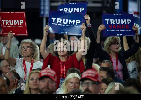 Milwaukee, Vereinigte Staaten. 16th July, 2024. Attendees hold up Trump signs at the Republican National Convention in Milwaukee, Wisconsin at the Fiserv Forum on Tuesday, July 16, 2024. Credit: Annabelle Gordon/CNP/dpa/Alamy Live News Stock Photo