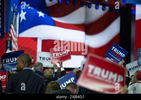 Milwaukee, Vereinigte Staaten. 16th July, 2024. Attendees hold up Trump signs at the Republican National Convention in Milwaukee, Wisconsin at the Fiserv Forum on Tuesday, July 16, 2024. Credit: Annabelle Gordon/CNP/dpa/Alamy Live News Stock Photo