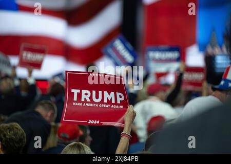 Milwaukee, Vereinigte Staaten. 16th July, 2024. Attendees hold up Trump signs at the Republican National Convention in Milwaukee, Wisconsin at the Fiserv Forum on Tuesday, July 16, 2024. Credit: Annabelle Gordon/CNP/dpa/Alamy Live News Stock Photo