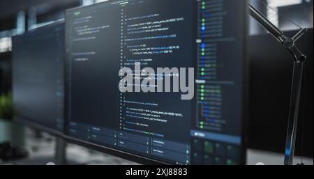 Close Up Focus on Desktop Computer Screen. Digital Display Showing Coding Language User Interface. Software Engineer Programming Innovative e-Commerce Software in Office Stock Photo