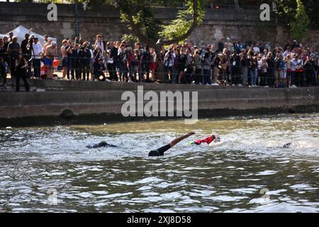 Paris, France. 17th July, 2024. After months of anticipation, Paris Mayor Anne Hidalgo swims in the Seine River on Wednesday, July 17, 2024 fulfilling a promise she made in January nine days before the opening ceremony of the 2024 Olympics. The swim occurs along the stretch of the river that passes by the imposing-looking City Hall and the Notre Dame Cathedral as part of a broader effort to showcase the river's improved cleanliness. Photo by Raphael Lafargue/ABACAPRESS.COM Credit: Abaca Press/Alamy Live News Stock Photo