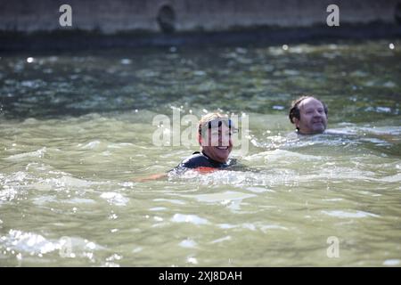 Paris, France. 17th July, 2024. After months of anticipation, Paris Mayor Anne Hidalgo swims in the Seine River on Wednesday, July 17, 2024 fulfilling a promise she made in January nine days before the opening ceremony of the 2024 Olympics. The swim occurs along the stretch of the river that passes by the imposing-looking City Hall and the Notre Dame Cathedral as part of a broader effort to showcase the river's improved cleanliness. Photo by Raphael Lafargue/ABACAPRESS.COM Credit: Abaca Press/Alamy Live News Stock Photo