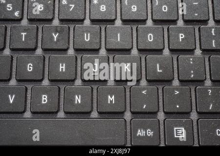Terengganu, Malaysia - 2 August 2024 : Top view of grey keyboard laptop texture Stock Photo