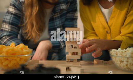 Multiracial couple diversity Caucasian man guy male African American woman girl female boyfriend husband and wife girlfriend at home couch playing Stock Photo