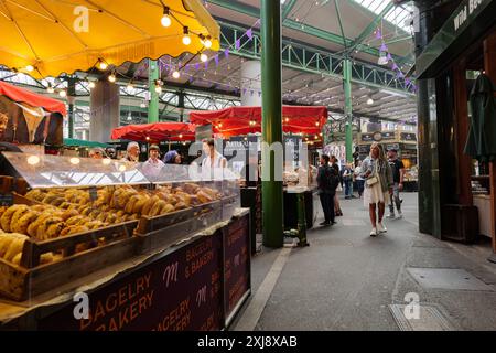 London - 06 10 2022: People meet and stroll at Borough Market Stock Photo