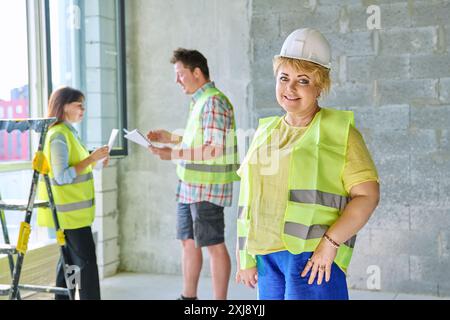 Female designer managing finishing decoration looking at camera Stock Photo