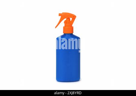 a blue sunscreen bottle with an orange spray nozzle, on a white background Stock Photo