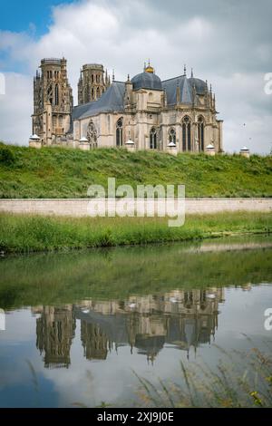 Distant view of the Cathedral of Toul from the bridge over the Moselle with the reflection in the river Stock Photo