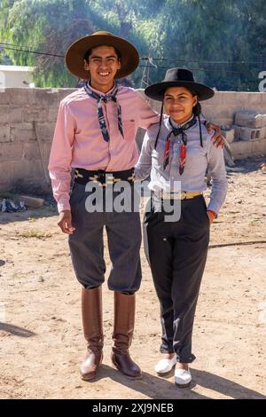 A young male & a female gaucho in their traditional outfits in Cachi, Argentina. Stock Photo