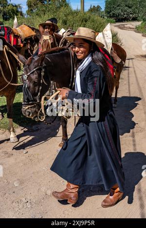 A female gaucho in traditional dress in a parade in Cachi, Argentina ...