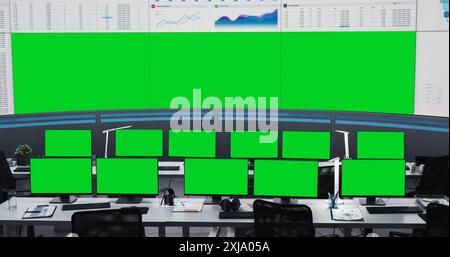 Empty Monitoring Office With Green Screen Chromakey Desktop Computer Monitors Of Employees. Big Digital Screens Showing Graphs And Charts. Mockup Template Of Successful Financial Analytics Company. Stock Photo