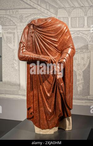 Man in ancient Roman clothes takes part during the event. Figures from ...
