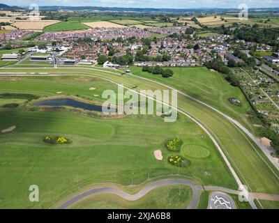 Hereford racecourse UK aerial view showing part of the race course with a gold course and cycle track within photo July 2024 Stock Photo