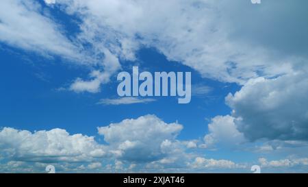 Time lapse. Fluffy curly rolling cloud in windy weather. Blue sky white ...