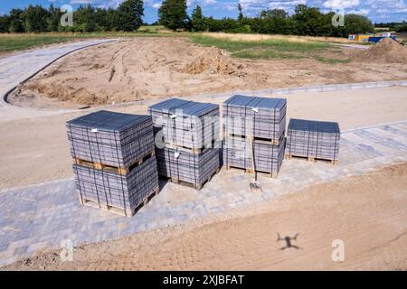many Paving stones are placed on pallets to pave a path Stock Photo