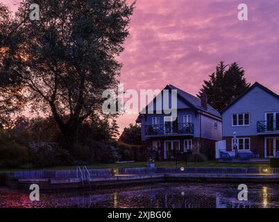 Sunset at Loddon with magenta sky on the Norfolk Broads UK Stock Photo