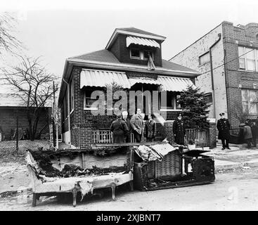 Exterior view of the home of Malcolm X after it was firebombed, remains of charred furniture in foreground, 23-11 97th Street, East Elmhurst, Queens, New York City, New York, USA, Stanley Wolfson, New York World-Telegram and the Sun Newspaper Photograph Collection, February 14, 1965 Stock Photo