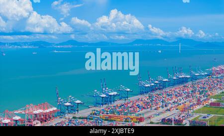 GUANGZHOU, CHINA - JULY 13, 2024 - Cargo ships load and unload cargo at ...