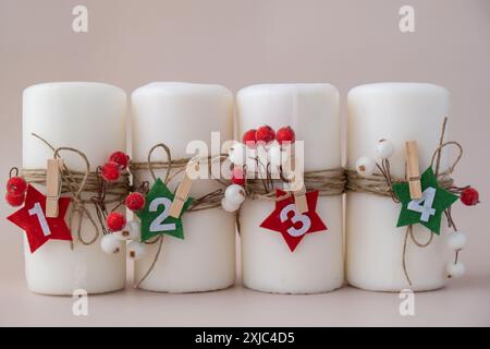 Four Advent candles calendar with Christmas zero waste decorations. Holiday preparation copy space for text. Catholic traditions of Christmas countdown new year winter holidays  Stock Photo