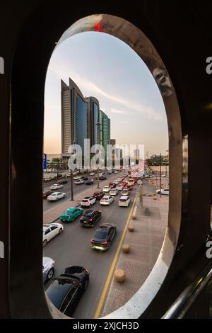 Riyadh, Saudi Arabia: Traffic rushes along the King Fadh road view through a pedestrian bridge in the Riyadh downtown district in Saudi Arabia capital Stock Photo