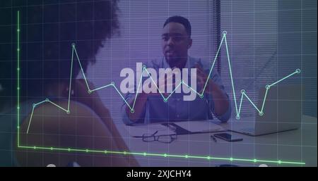 Image of graph and grid pattern over diverse coworkers discussing reports on laptop in office Stock Photo