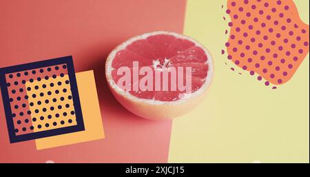 Image of abstract shapes over halved grapefruit on yellow and red background Stock Photo