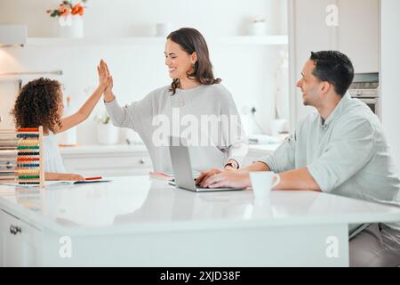 Happy mother, daughter and good job with high five for homework, finished or well done at home. Mom touching young child or kid with smile for Stock Photo