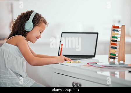 Child, laptop and mockup or writing homework, online classes and elearning for education for mathematics study. Abacus, counting tool and learning Stock Photo