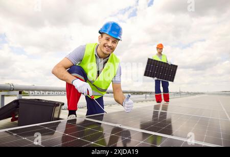 P:rofessional worker technician in uniform standing at construction site and showing thumb up sigh Stock Photo