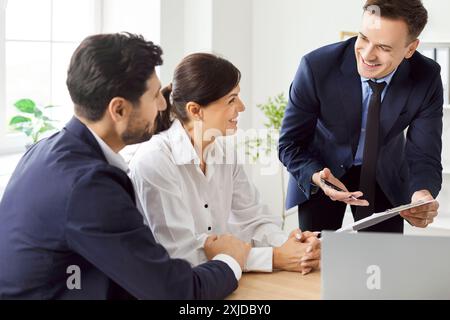 Group of colleagues discussing workplace strategy, close-up Stock Photo