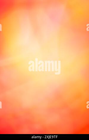 Abstract bright warm red-orange background with bokeh defocused lights and shadow on it. Vertical. Backdrop Stock Photo