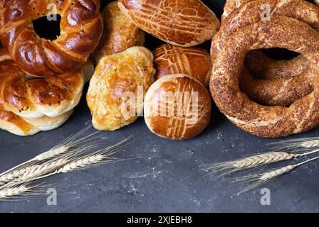Traditional Turkish pastry concept, pogaca , bagel, on rustic table, famous bakery product Stock Photo