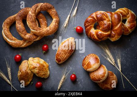 Traditional Turkish pastry concept, pogaca , bagel, on rustic table, famous bakery product Stock Photo